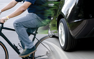 bicyclist and automobile